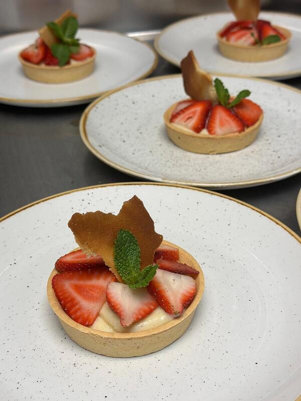 Dessert tarts with strawberries prepared by Alley Cat Oyster Bar